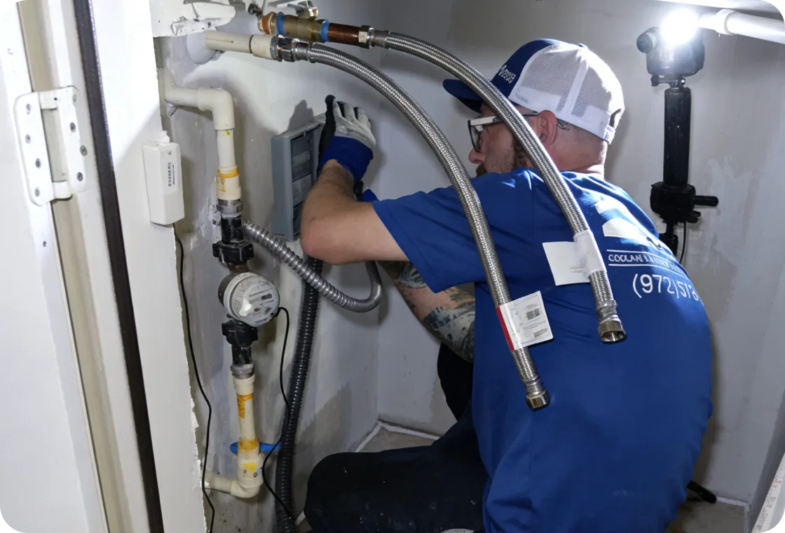 Tempo Plumbing technician working on water heater connections