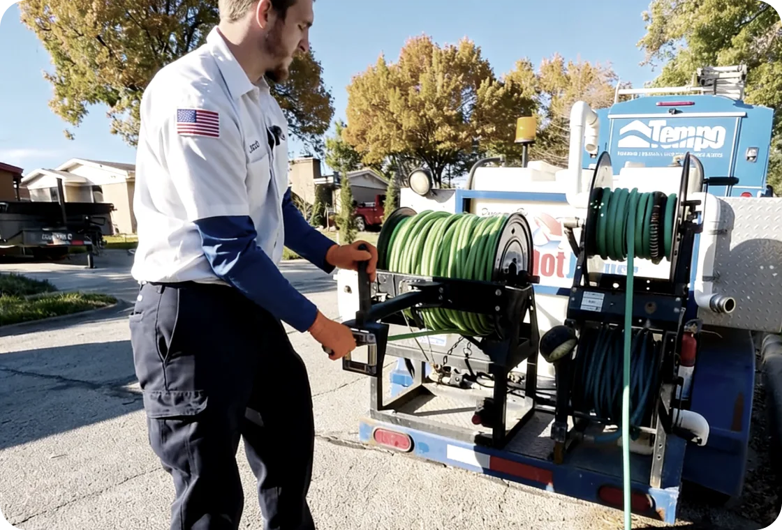 Tempo Plumbing technician with hydro jetting equipment