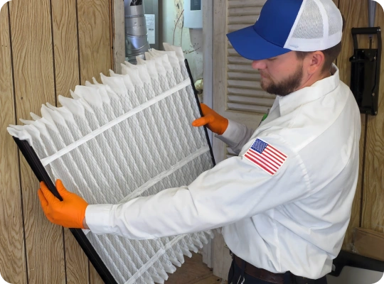 Tempo Mechanical technician installing an HVAC air filter
