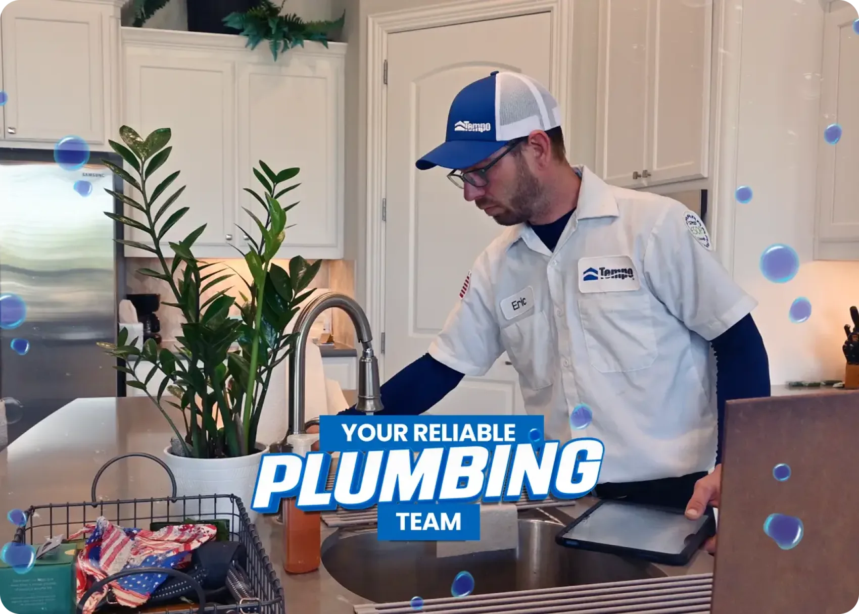 Tempo Plumbing technician repairing a kitchen sink